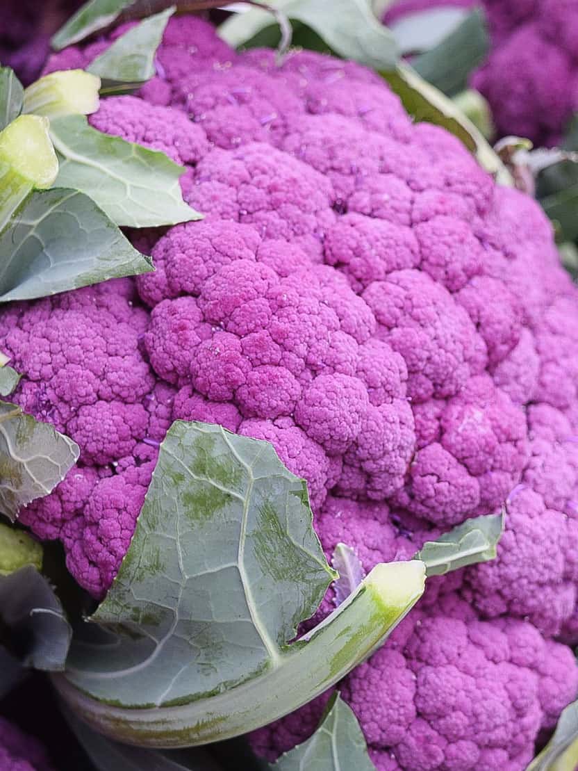 A few pink cauliflowers for sale.