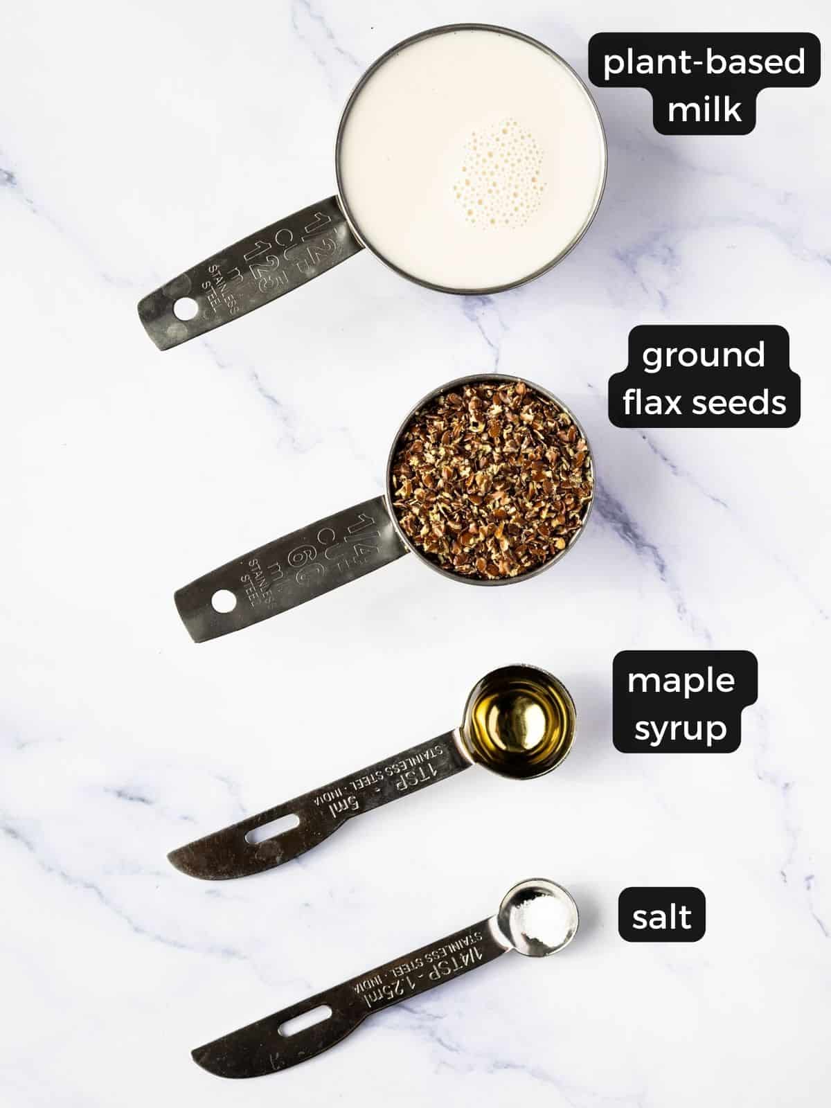 Ingredients for a flax seed pudding: plant milk, ground flax seeds, maple syrup, and salt.