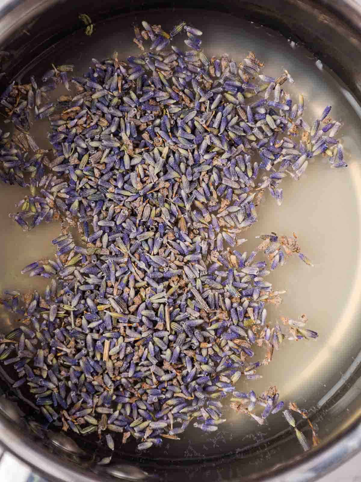 Apple juice, water, and lavender in a small saucepan.