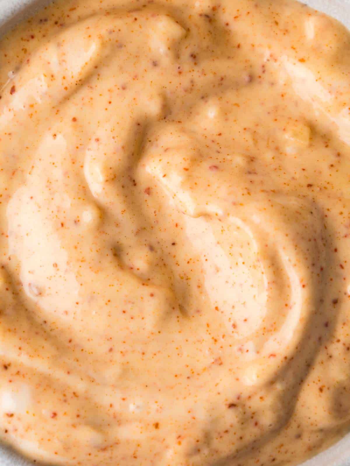 Close-up of garlic chili aioli to clearly show its texture.