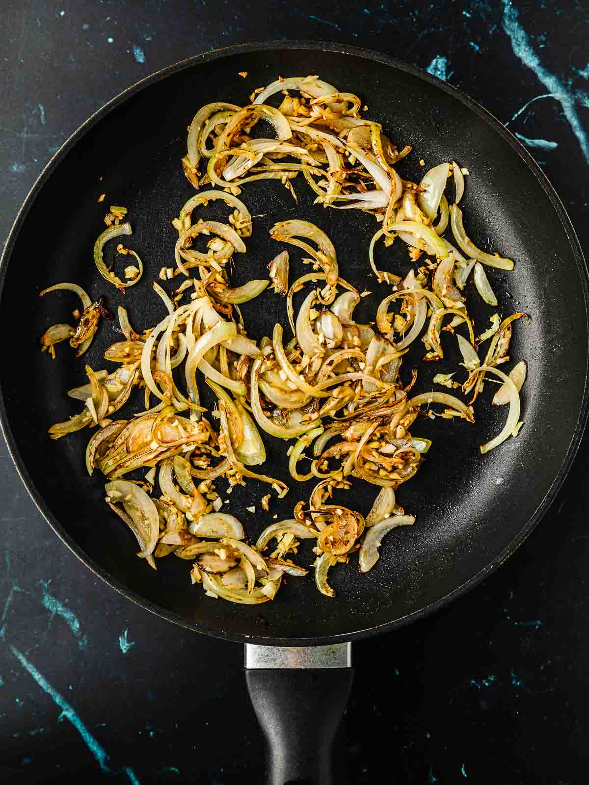 Sliced onion and garlic after being sauteed.